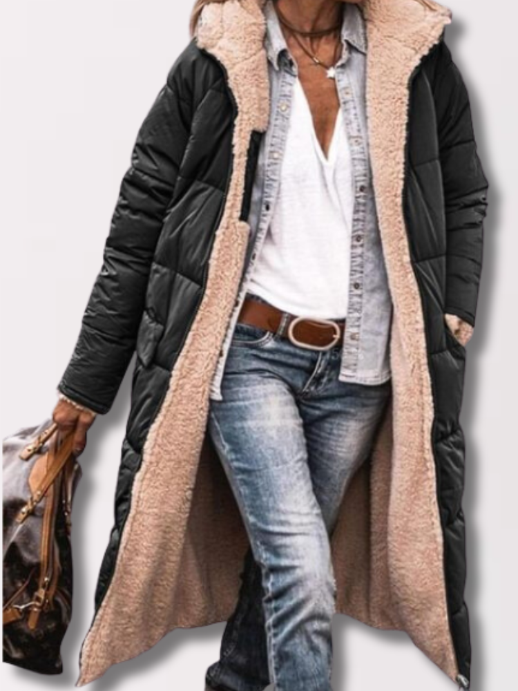 Woman wearing a long hooded quilted puffer coat with contrasting textured trim