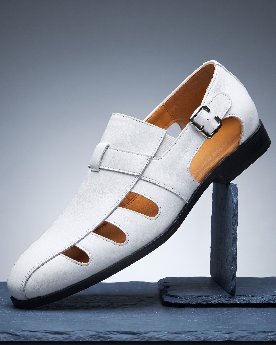 Monk strap dress loafer with cutout panels and buckle fastening