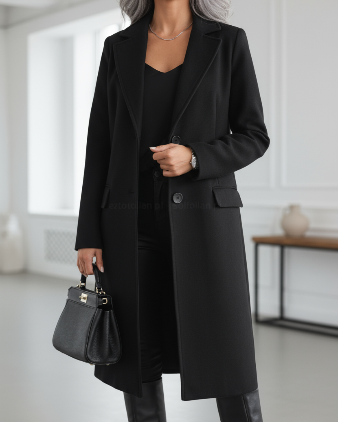 Women's long tailored coat with notched lapels, long sleeves and button front