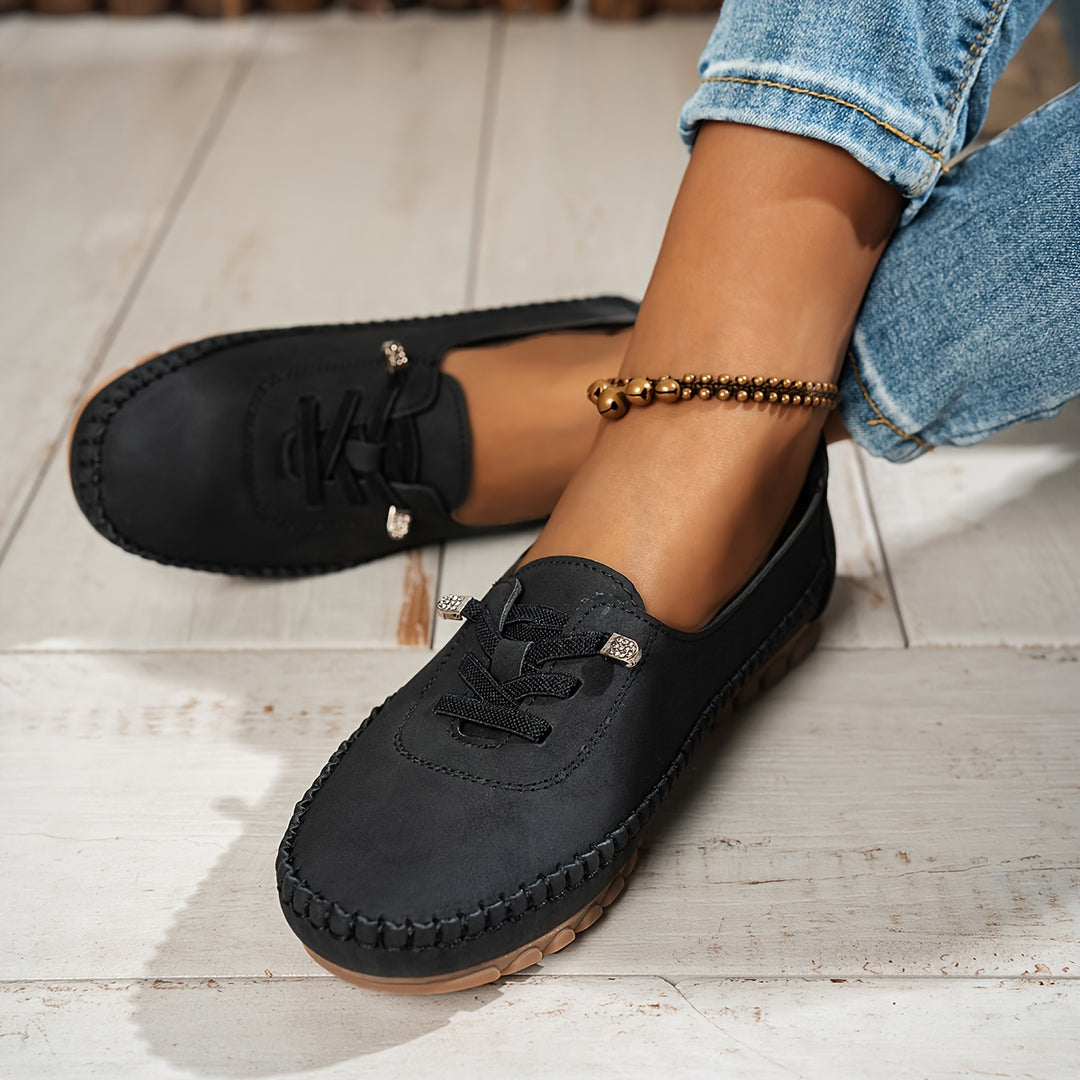 Women's moccasin loafers with lace detail, stitched trim and flat textured soles