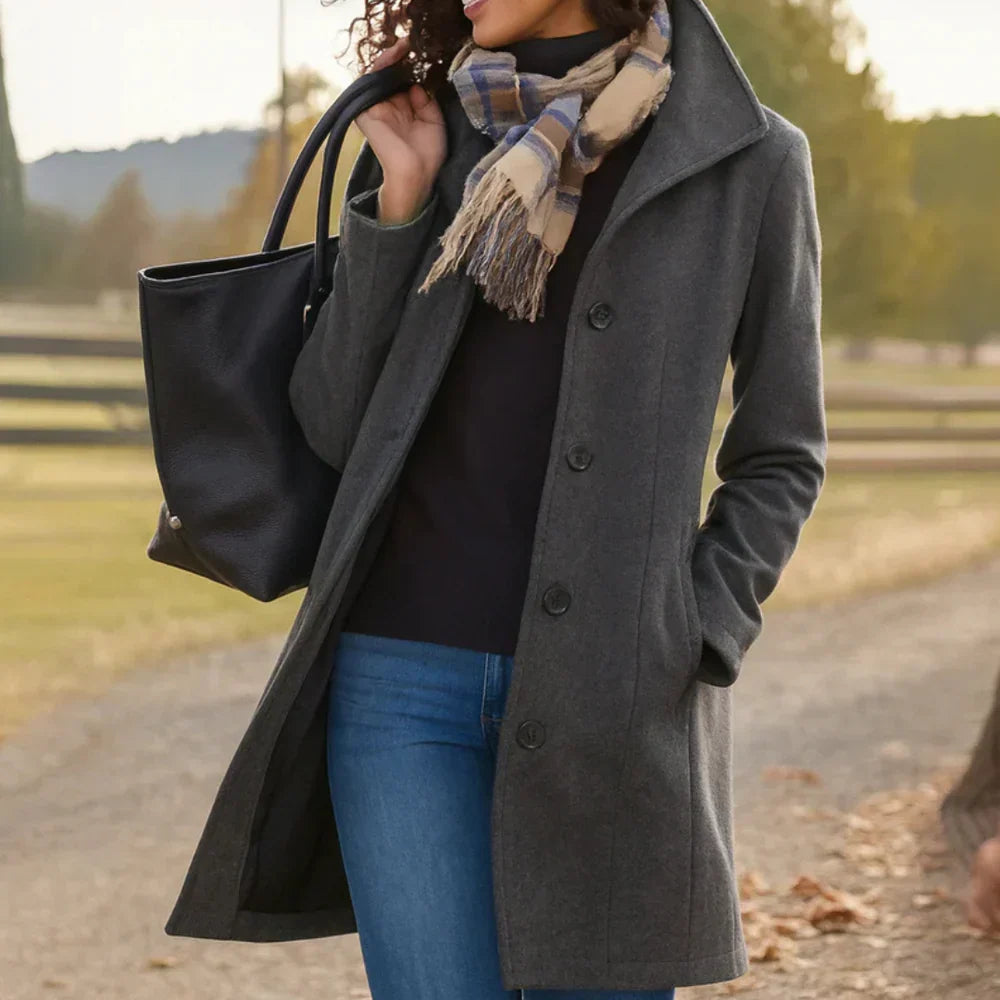 Women's long button-front coat with shirt collar, long sleeves and side pockets