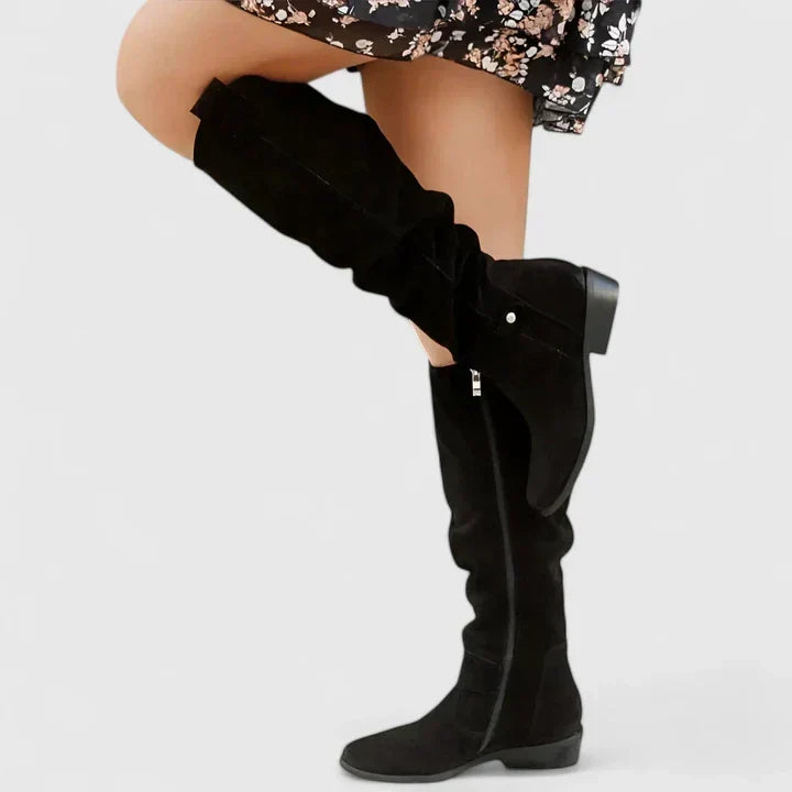 Women's slouch over-the-knee boots with low heels, side zips and strap detailing