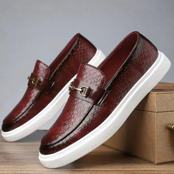 Men's textured slip-on loafers with buckle detail and contrasting flat soles