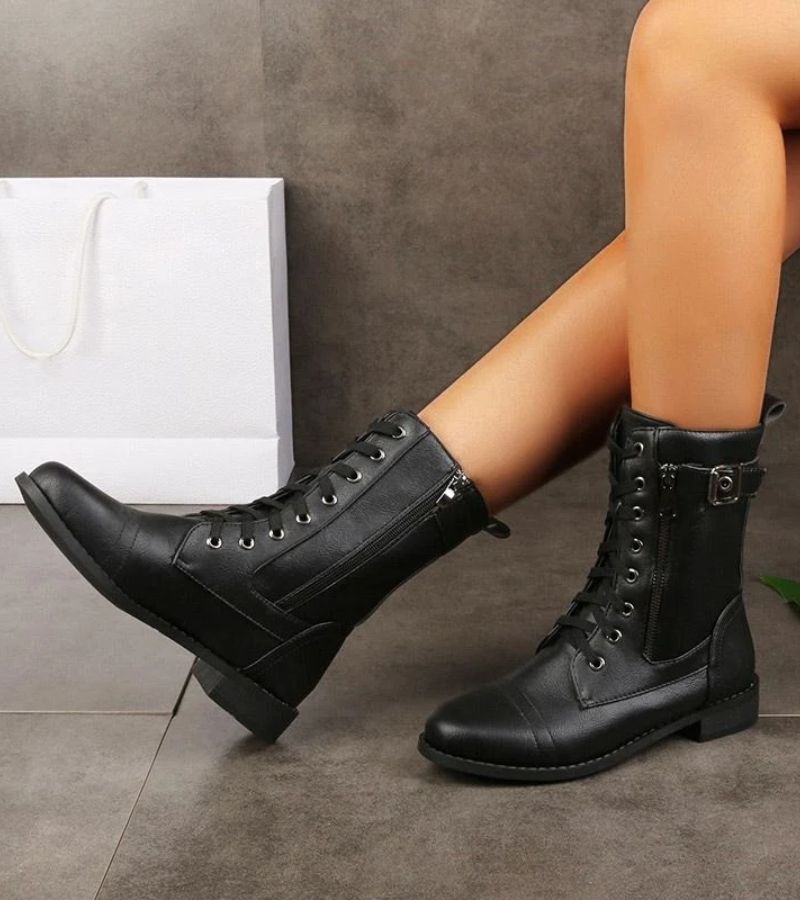 Women's mid-height combat boots with laces, side zip and buckle detail
