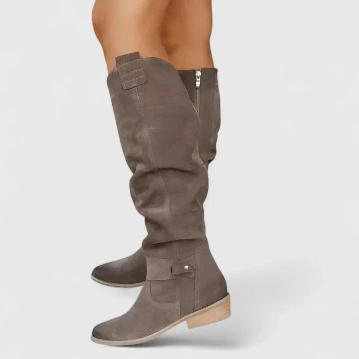 Women's slouch over-the-knee boots with low heels, side zips and strap detailing
