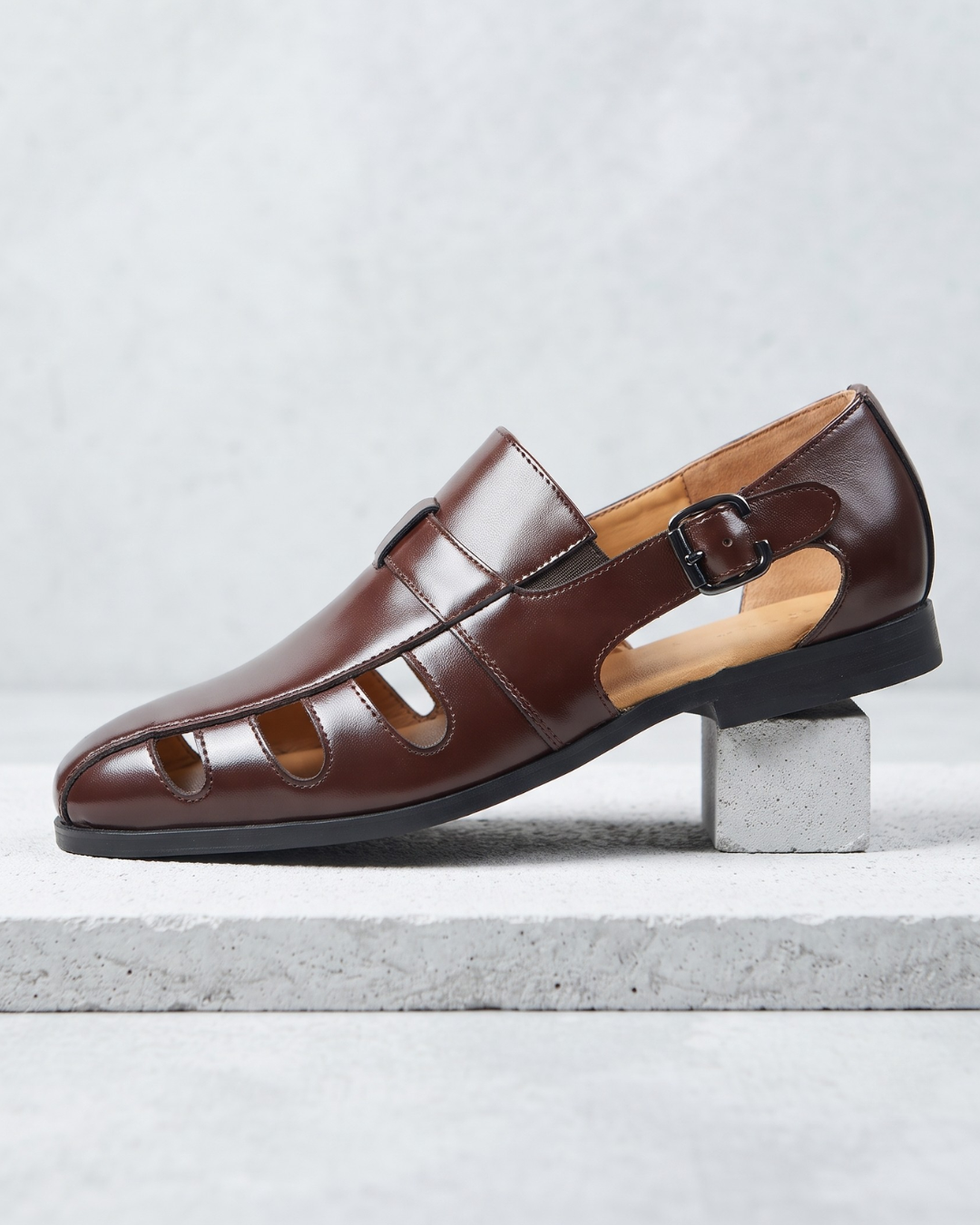 Monk strap dress loafer with cutout panels and buckle fastening