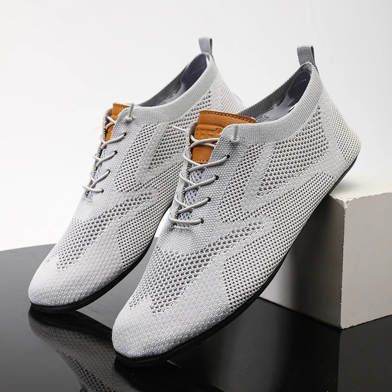 Mesh knit lace-up trainers with textured panels, round toes and flat soles