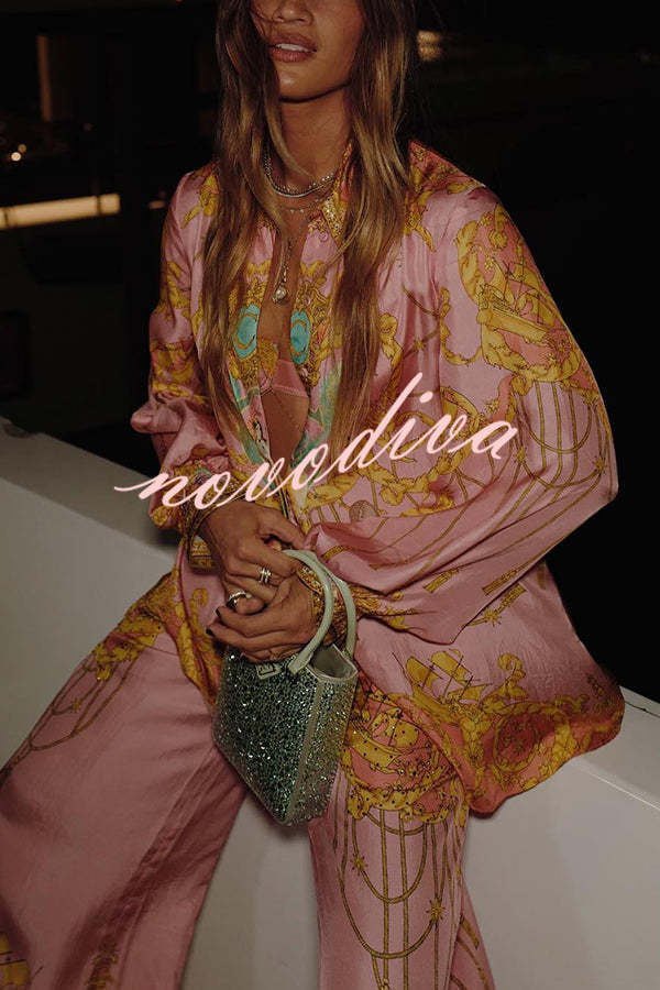 Woman wearing a pink abstract print shirt and wide-leg trousers set