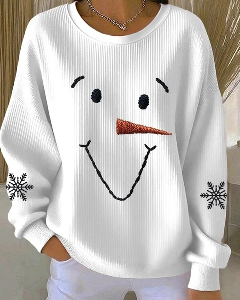 Women's white sweatshirt with a snowman face graphic and snowflake sleeve details