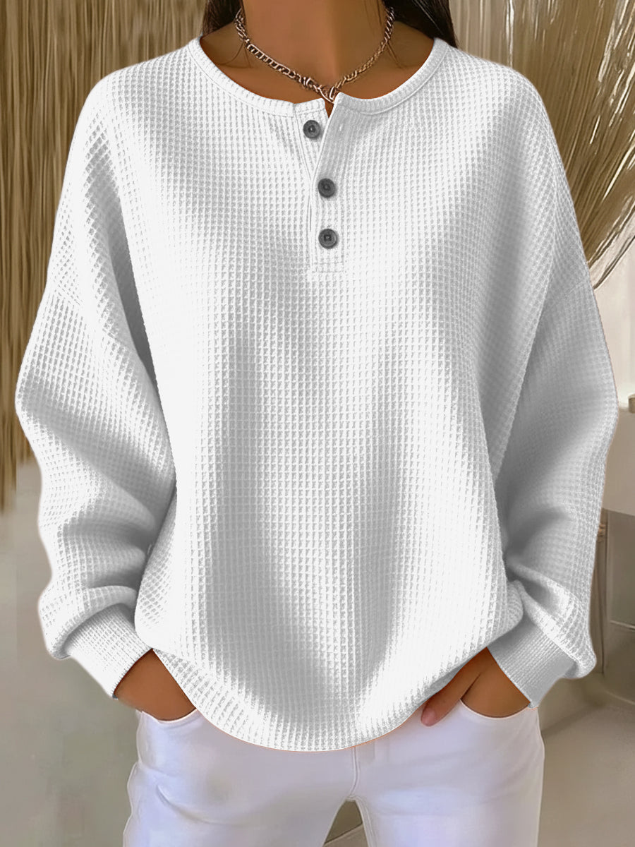 Women's textured waffle Henley top with round neck, long sleeves and button placket