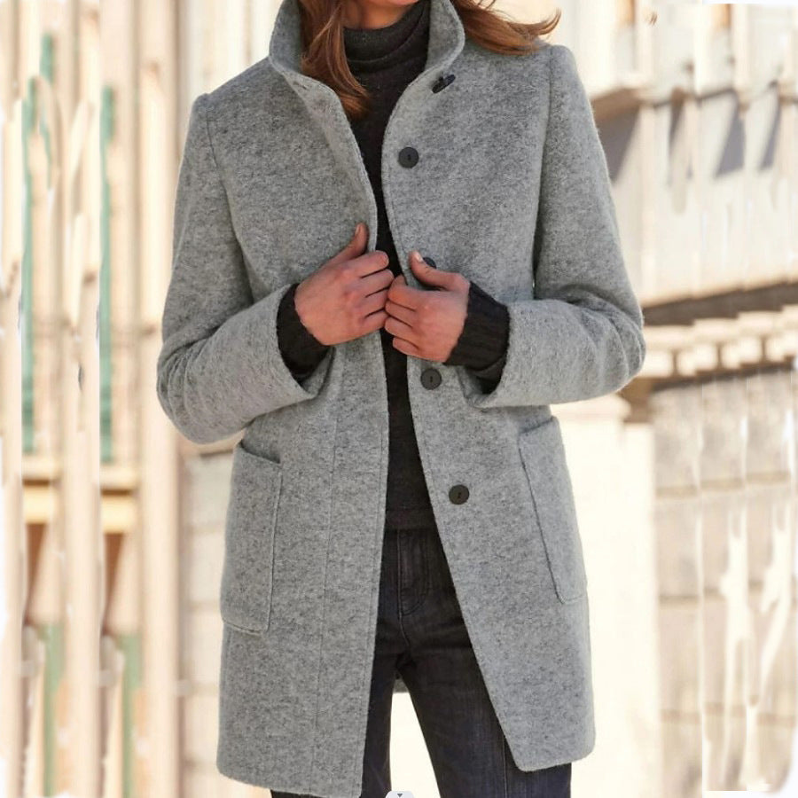 Women's high-neck button front coat with long sleeves and patch pockets