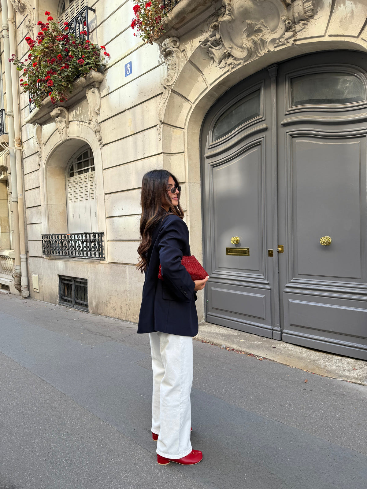 Women's navy blazer with notched lapels, long sleeves and button front