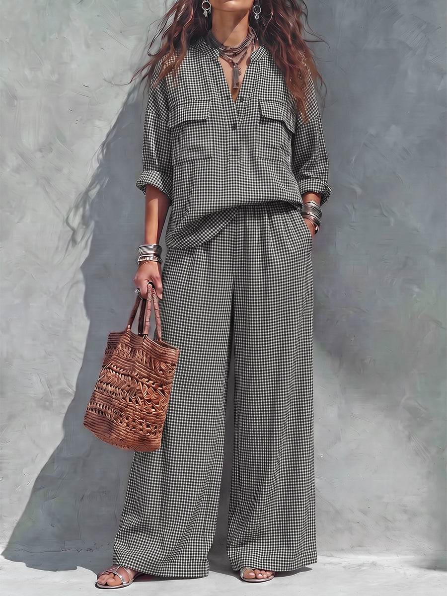 Women's black and white checked wide-leg trousers with elasticated waist and side pockets
