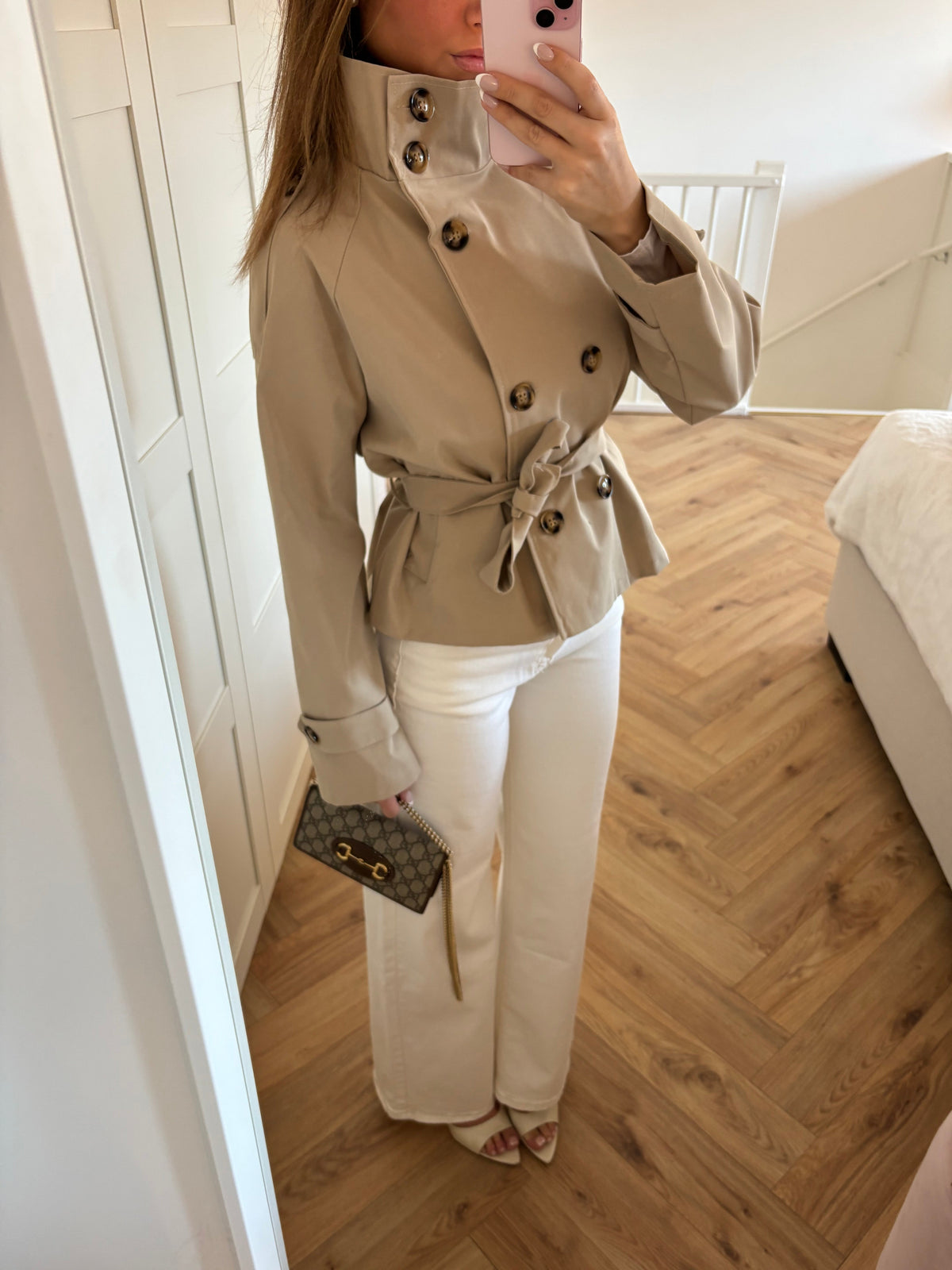 Women's beige belted trench jacket with high collar and long sleeves