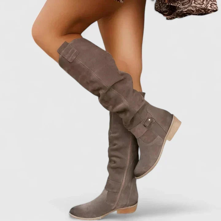 Women's slouch over-the-knee boots with low heels, side zips and strap detailing