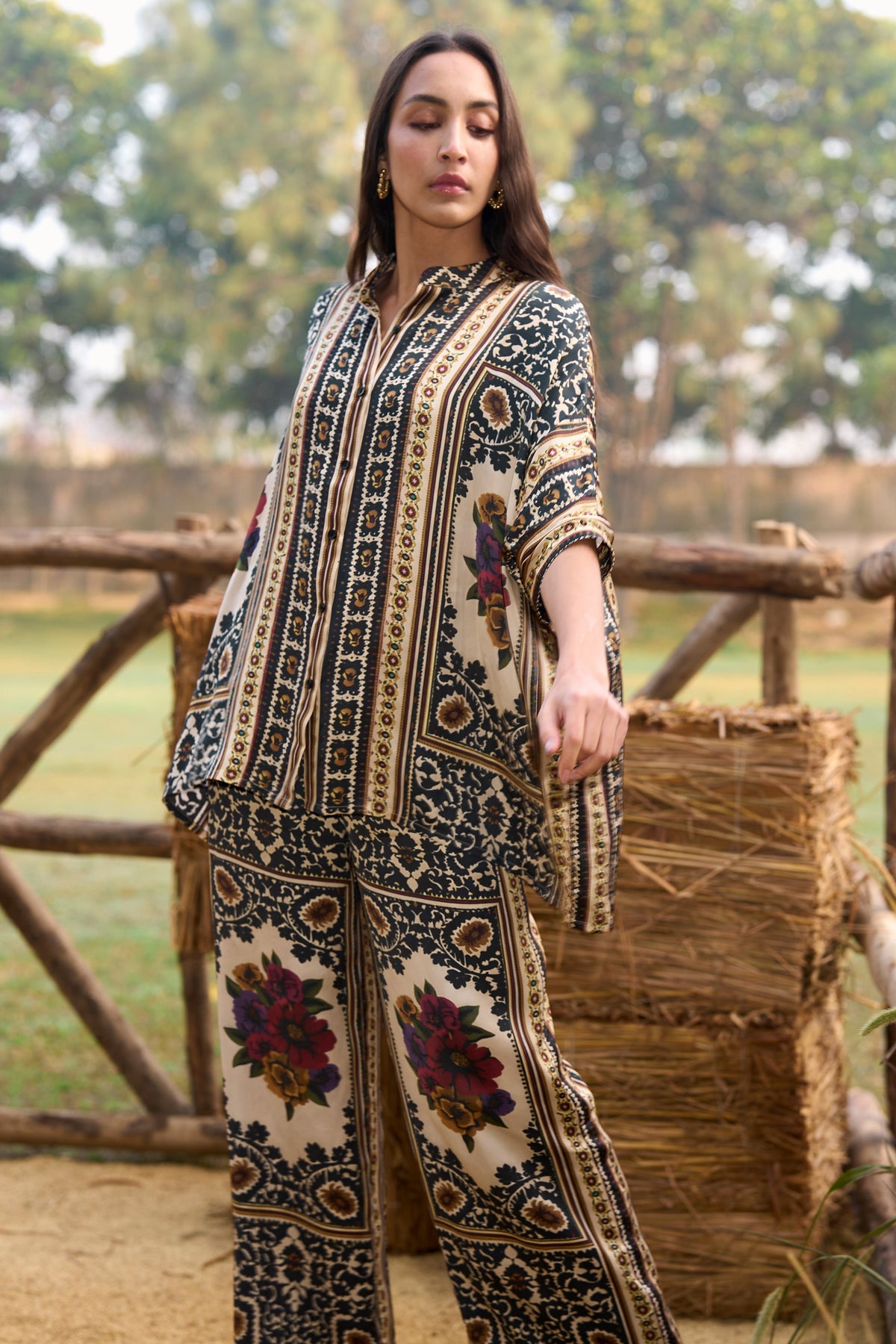 Woman wearing a multicoloured floral printed shirt and straight-cut trousers set