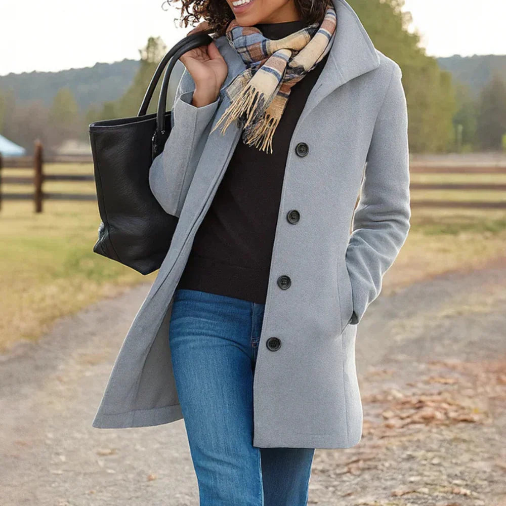 Women's long button-front coat with shirt collar, long sleeves and side pockets