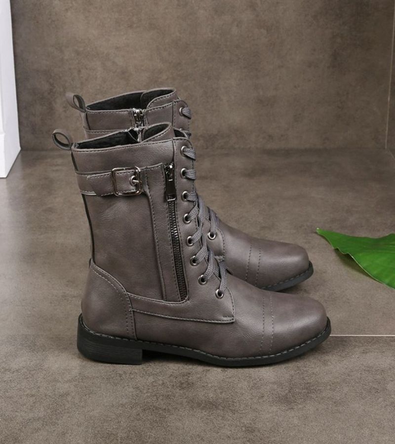 Women's mid-height combat boots with laces, side zip and buckle detail