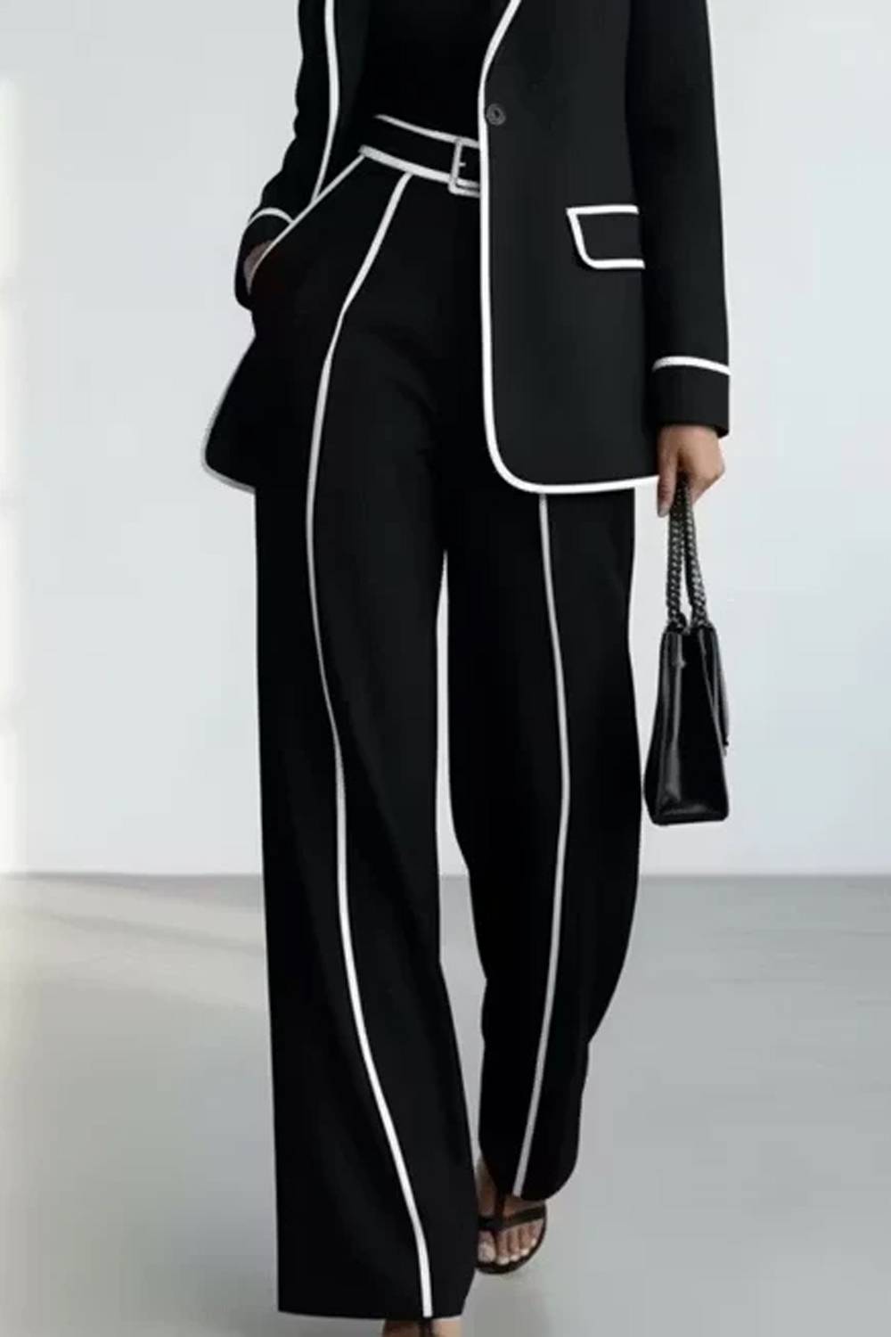 Women's two-piece trouser set with piped blazer and wide-leg trousers