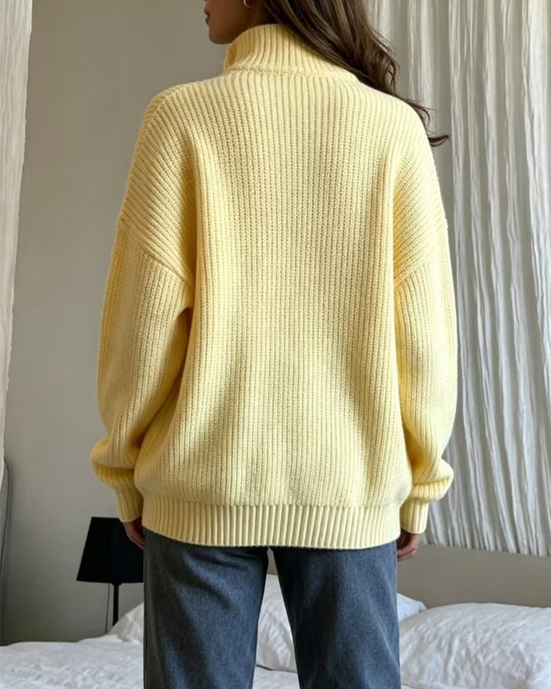 Women's yellow ribbed half-zip jumper with a funnel neck and long sleeves
