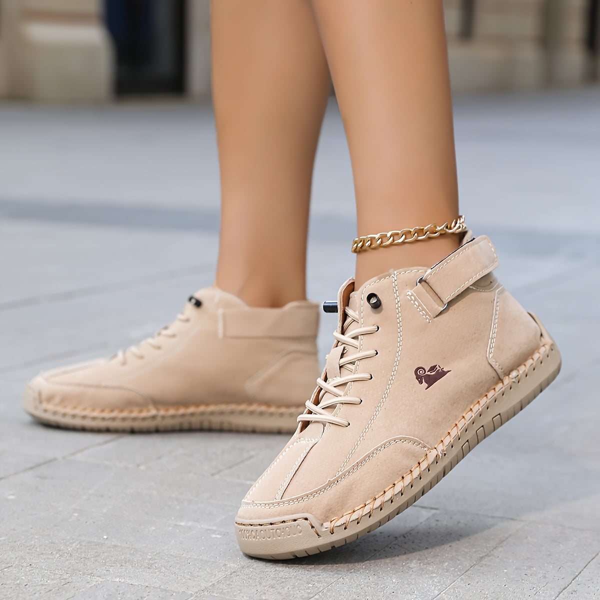 High-top lace-up sneakers with ankle straps and moc toes