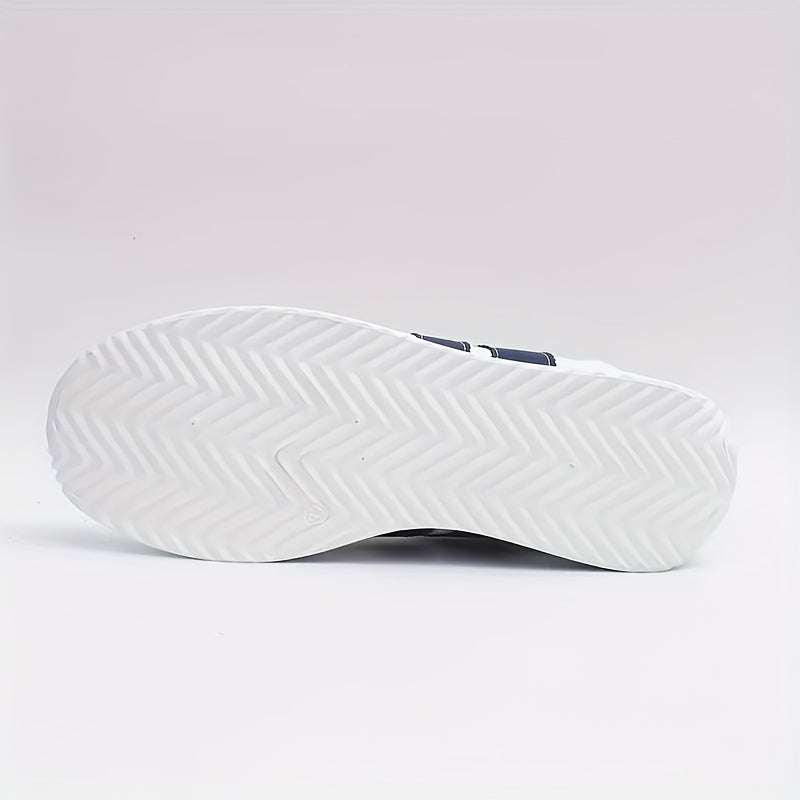 Women's white lace-up sneakers with navy side stripes and flat soles