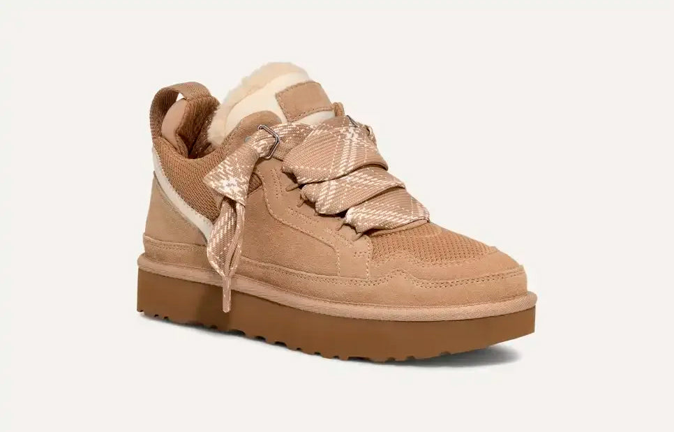 Beige women's high-top trainers with patterned laces and plush ankle trim