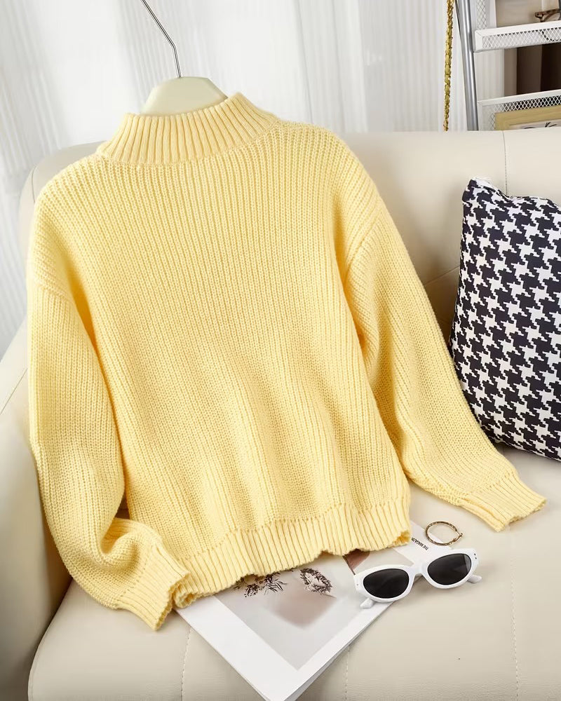 Women's yellow ribbed half-zip jumper with a funnel neck and long sleeves