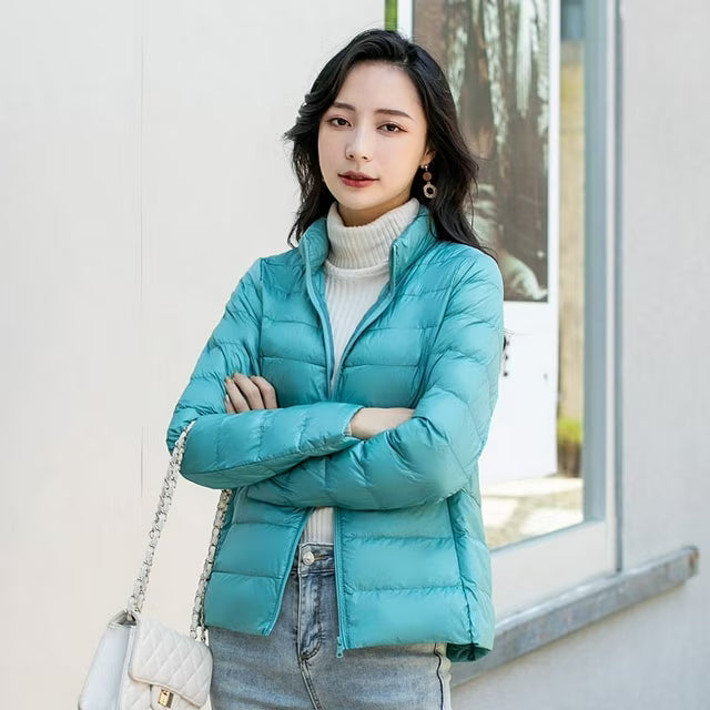 Women's quilted puffer jacket with high collar and zip front