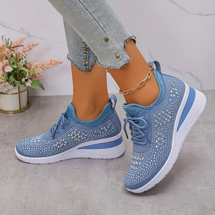 Women's lace-up mesh trainers with textured uppers and contrasting low-profile soles