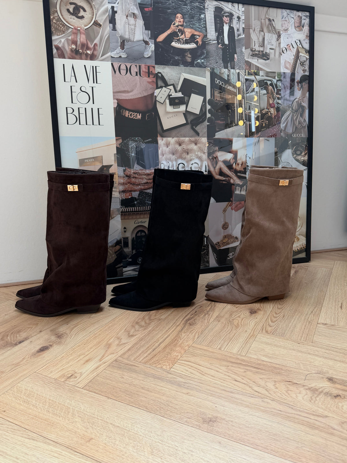 Women's beige knee-high boots with pointed toes, low block heels and buckle detail