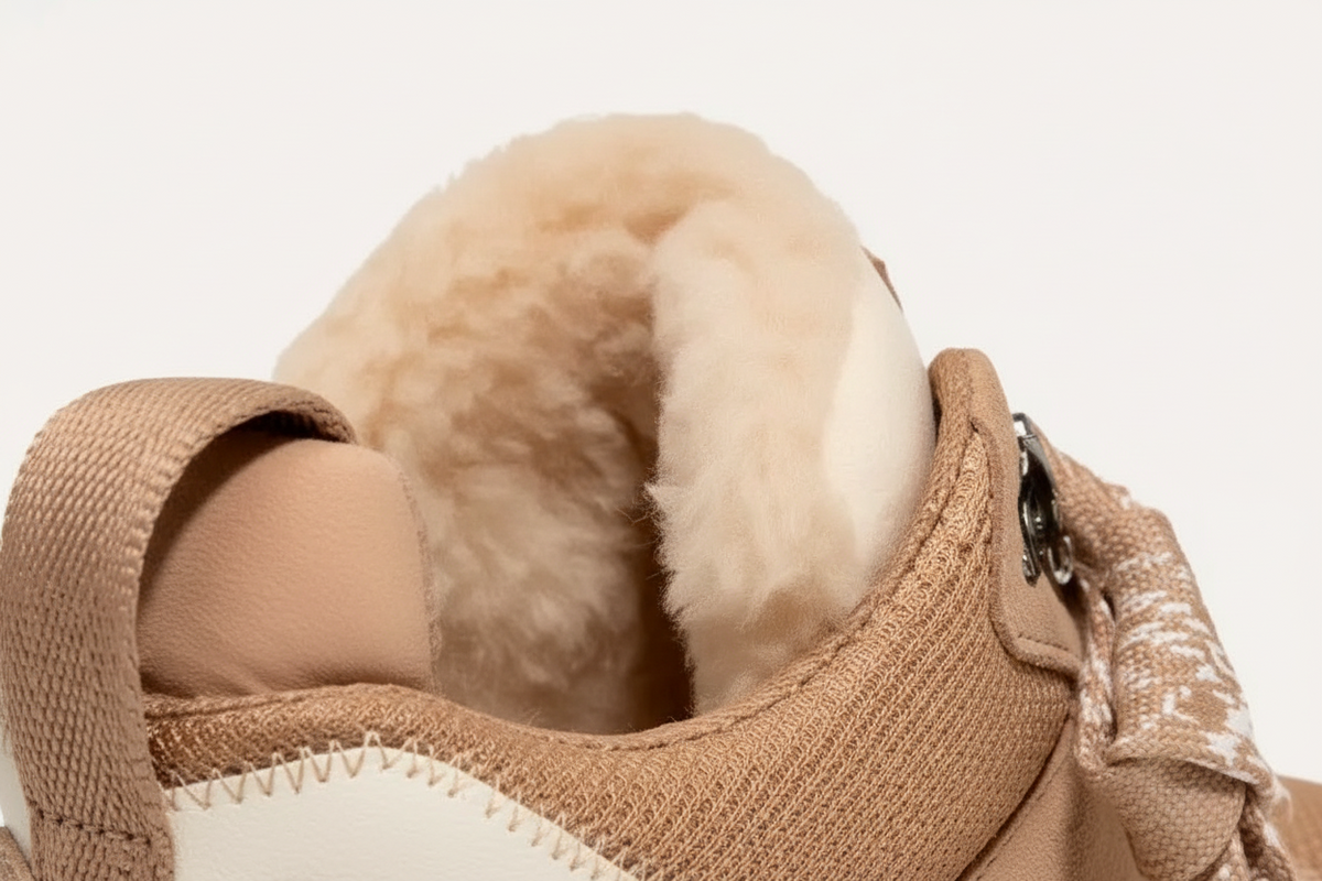 Beige women's high-top trainers with patterned laces and plush ankle trim