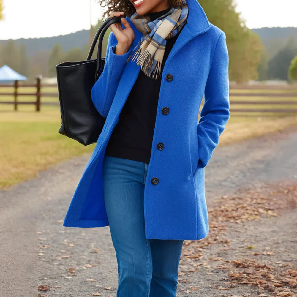Women's long button-front coat with shirt collar, long sleeves and side pockets
