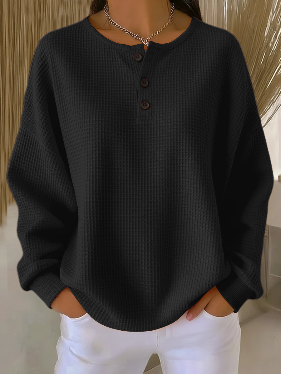 Women's textured waffle Henley top with round neck, long sleeves and button placket