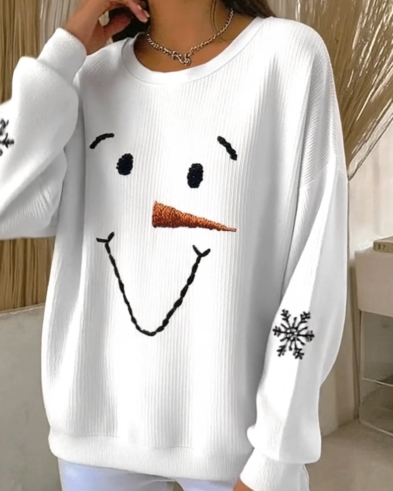 Women's white sweatshirt with a snowman face graphic and snowflake sleeve details
