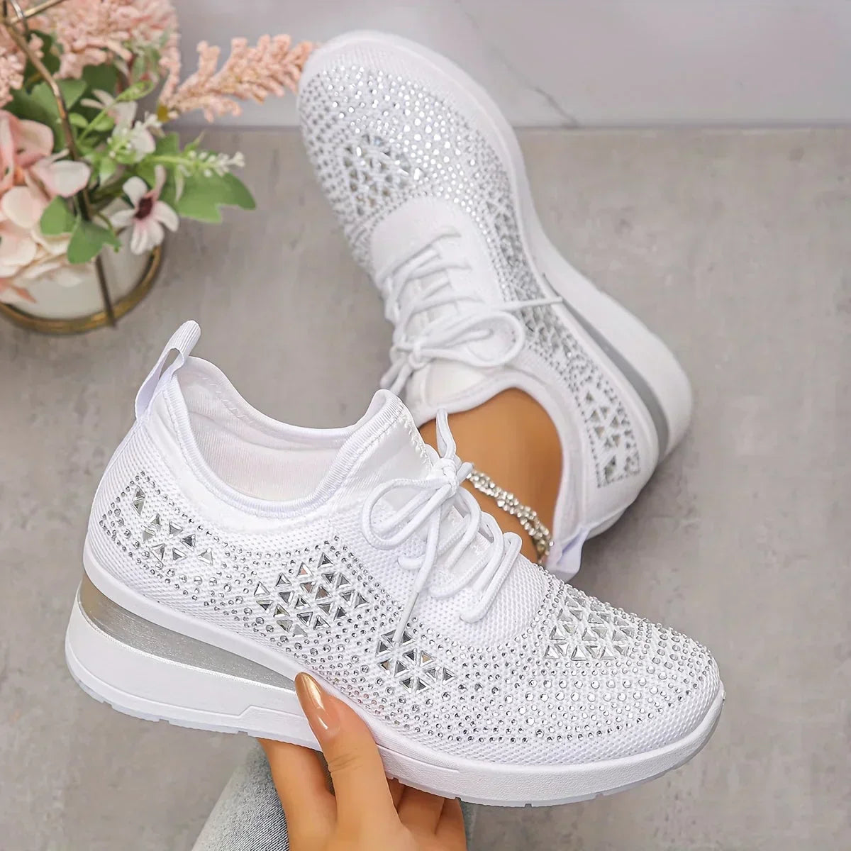 Women's lace-up mesh trainers with textured uppers and contrasting low-profile soles