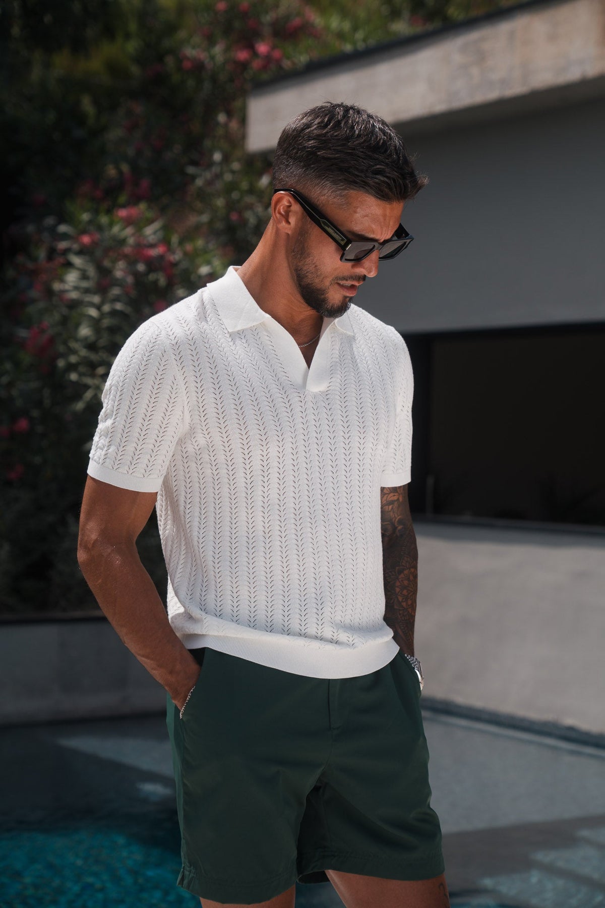 Men's white chevron knit polo shirt with short sleeves and ribbed trims