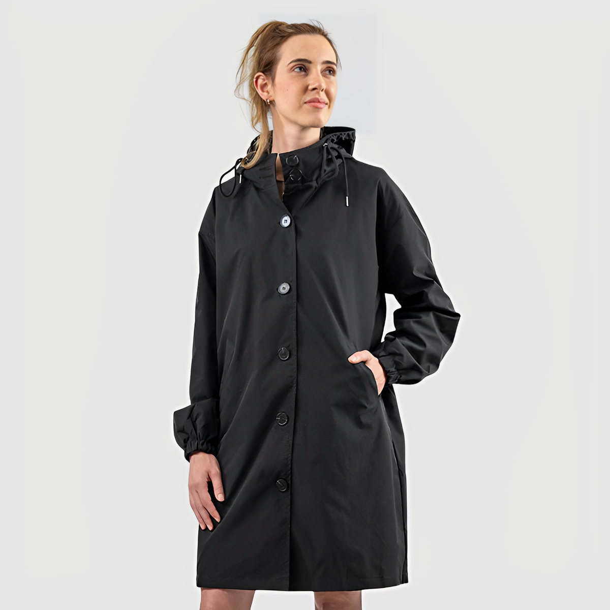 Women's longline hooded button-front rain jacket with side pockets