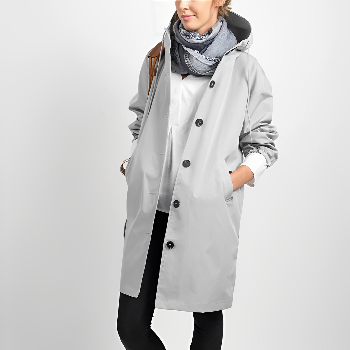 Women's longline hooded button-front rain jacket with side pockets