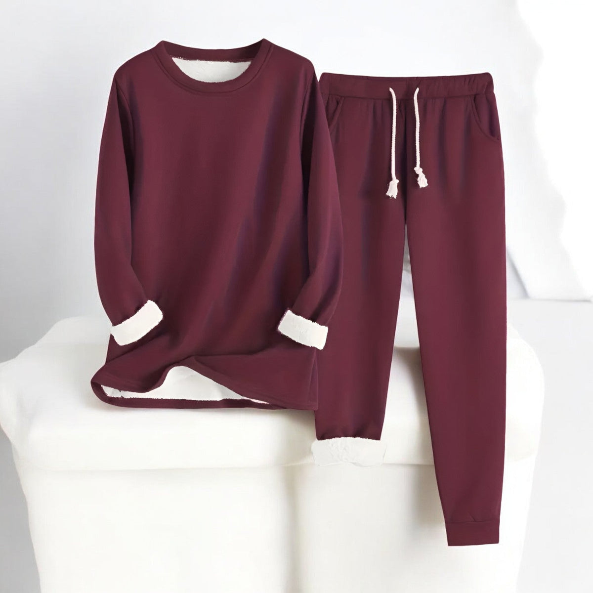 Two-piece crew neck sweatshirt and jogger set with contrasting white cuffs and drawstring trousers