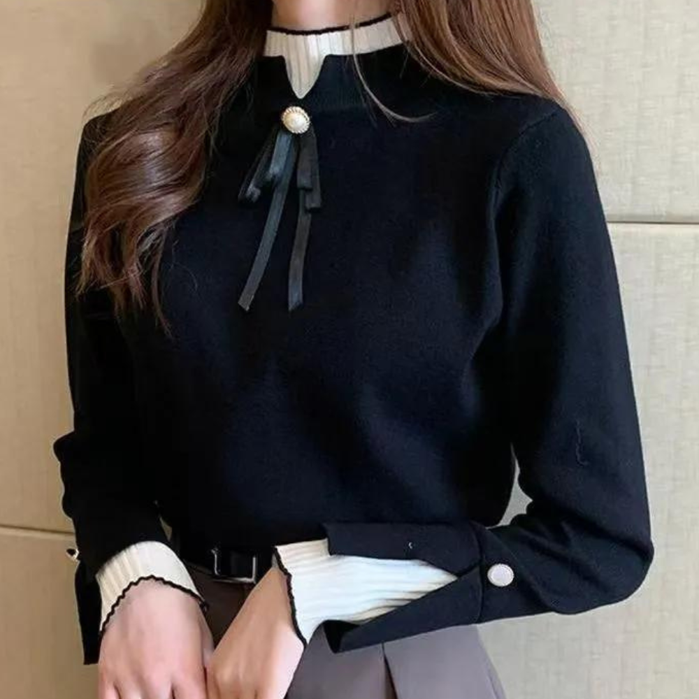 Women's fitted jumper with high ribbed neck, long sleeves and bow detail