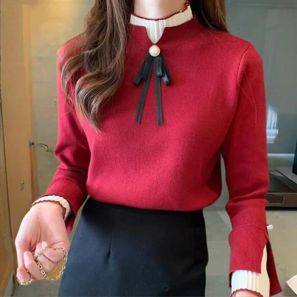 Women's fitted jumper with high ribbed neck, long sleeves and bow detail