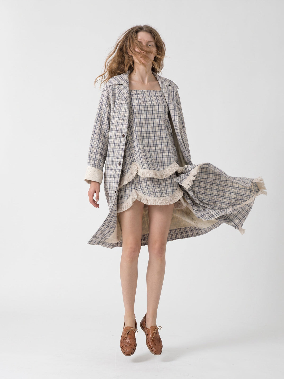 Women's beige checked long trench coat with notched collar and button front