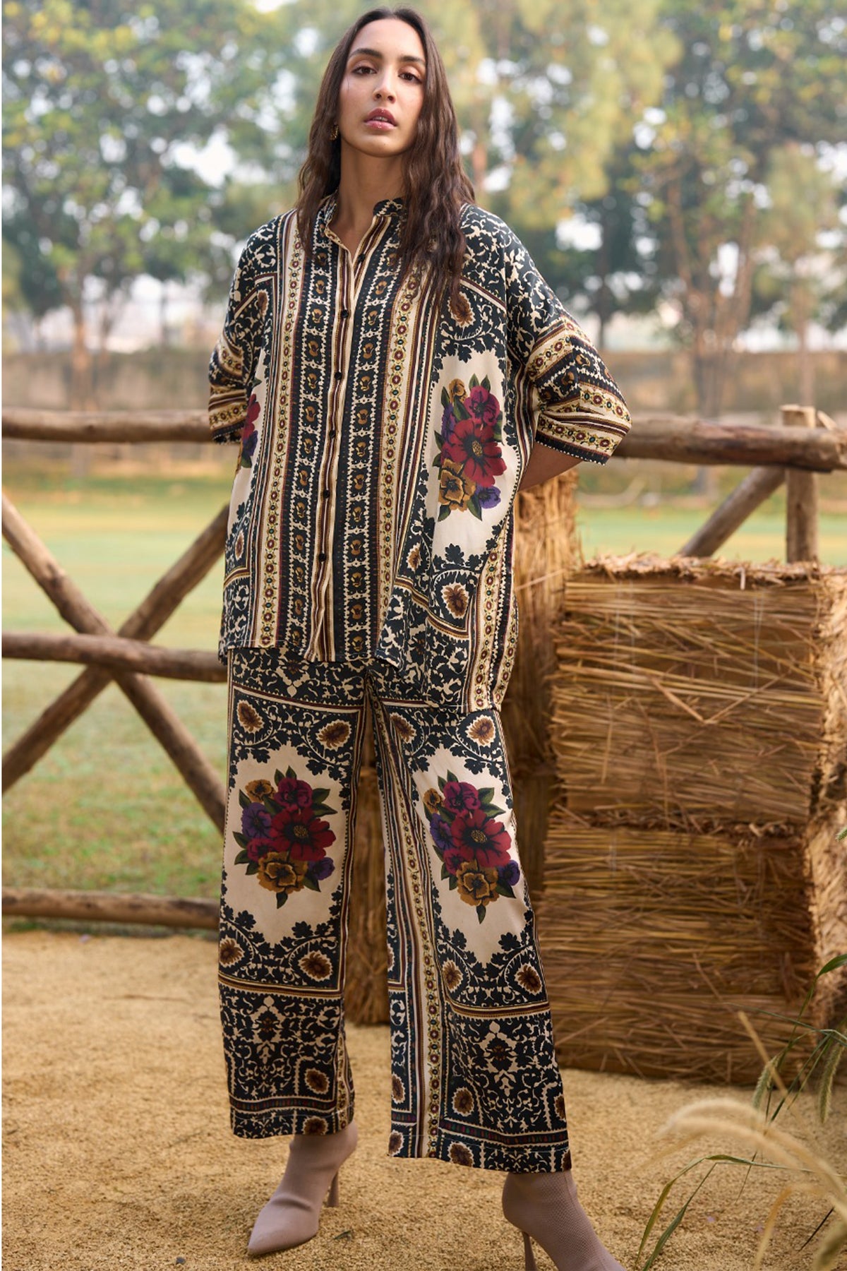 Woman wearing a multicoloured floral printed shirt and straight-cut trousers set
