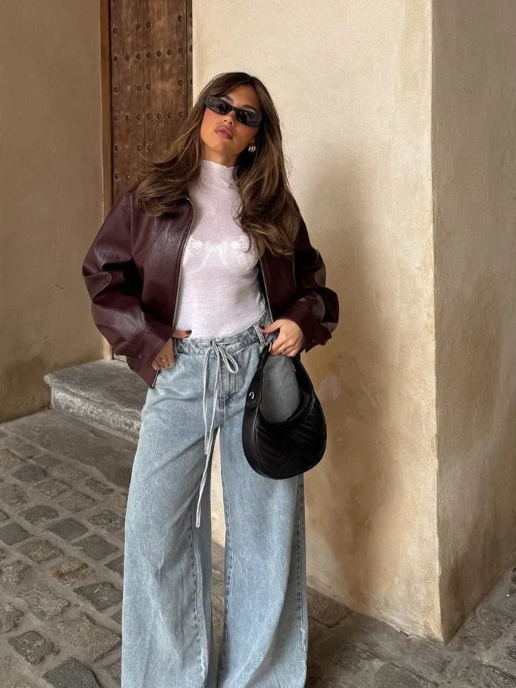 Women's burgundy oversized bomber jacket with zip front and long sleeves