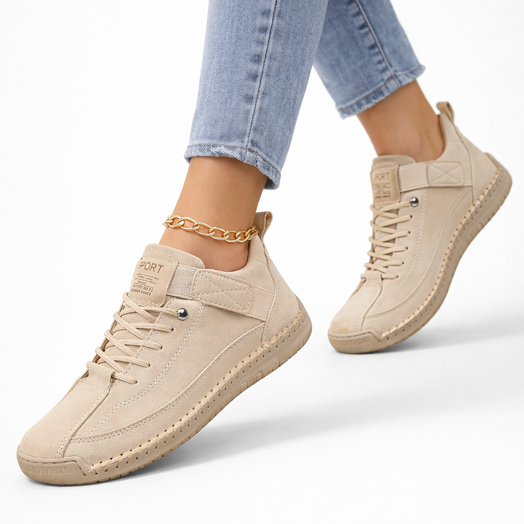 Women's lace-up ankle sneakers with rounded toes, strap detail and flat textured soles