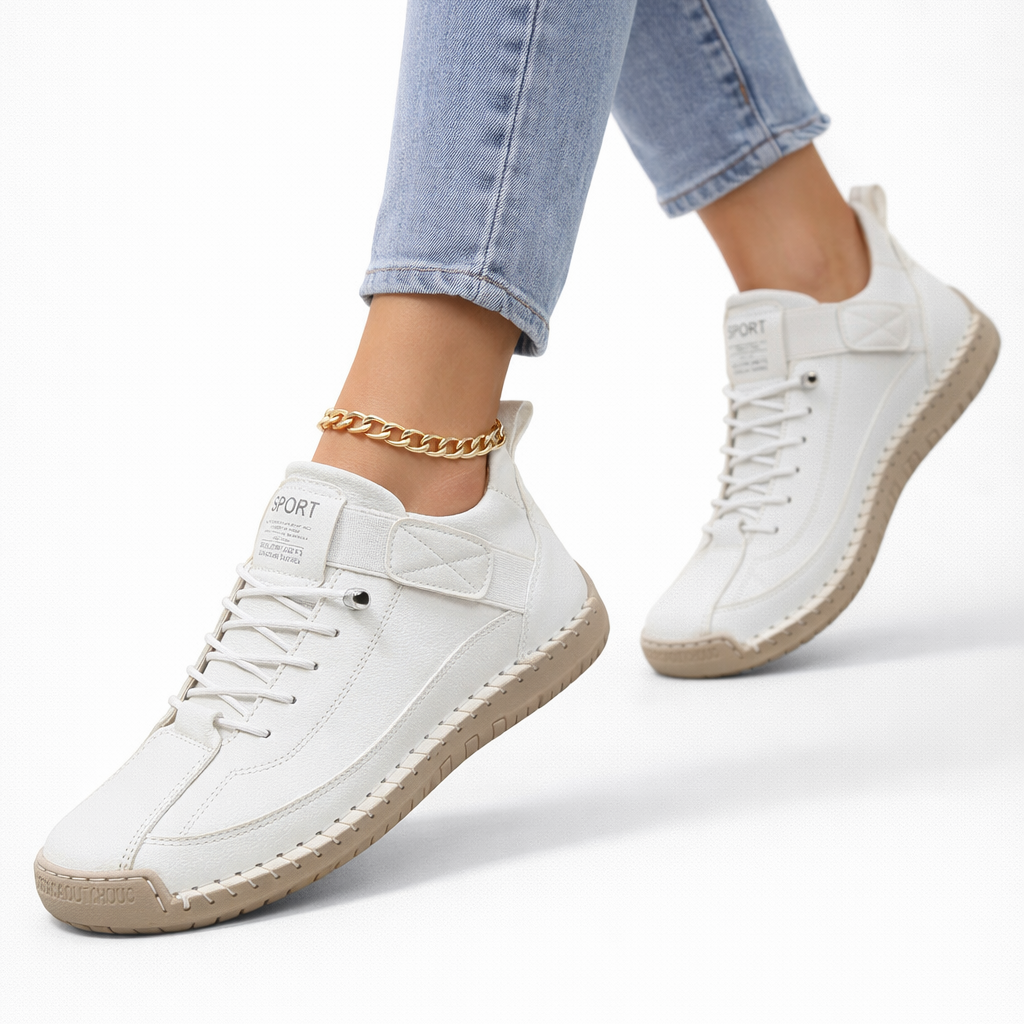 Women's lace-up ankle sneakers with rounded toes, strap detail and flat textured soles