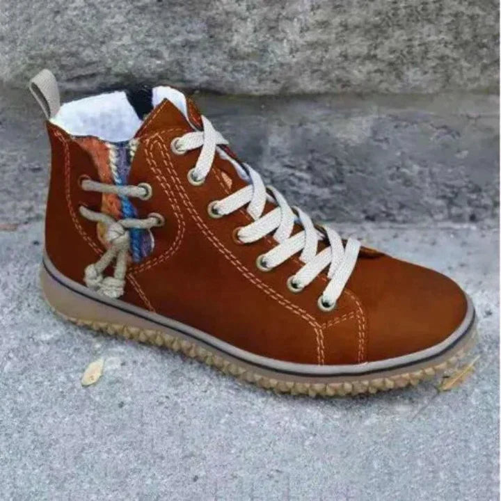 High-top lace-up boots with round toes, contrast stitching and flat textured soles