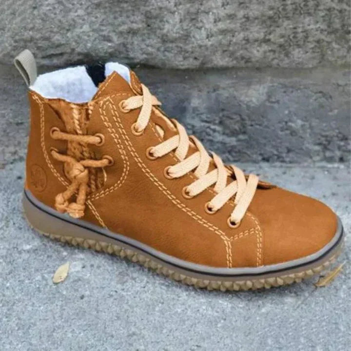 High-top lace-up boots with round toes, contrast stitching and flat textured soles