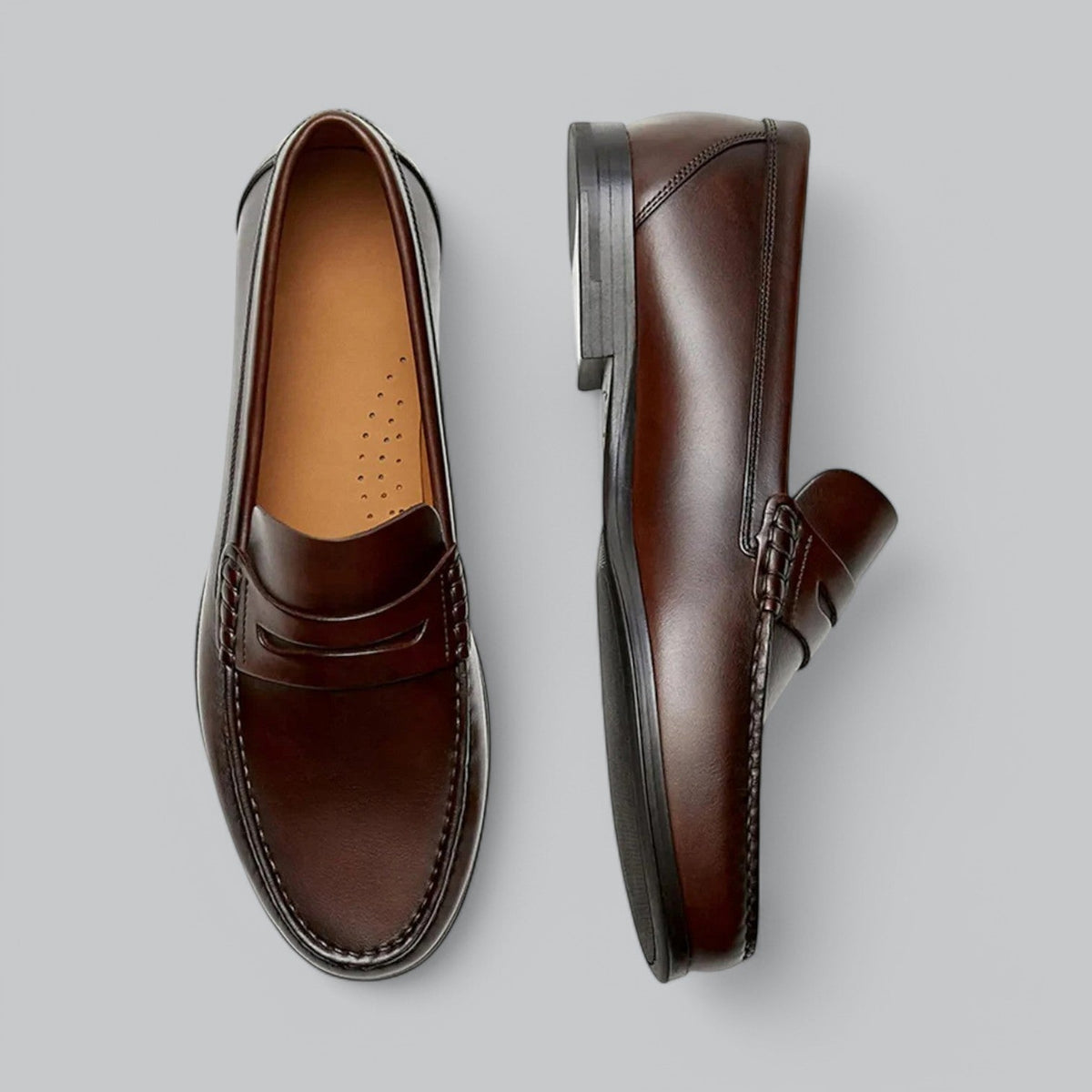 Men's plain penny loafers with stitched trim and low heel